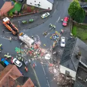 Man, 62, dies as bin lorry crashes into house in Leominster