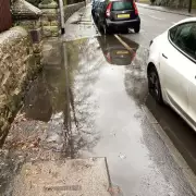 Eight-Year Flooding Crisis Forces Kidsgrove Children to Walk in Road