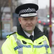 Chief Constable Craig Guildford retires after 30-year career amid pressure