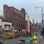 Major Fire Engulfs Historic Birmingham Building, Over 50 Firefighters Respond
