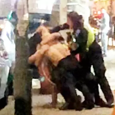 Shirtless Man Grapples with Police During Selly Oak Arrest After Jumping on Cars