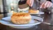 Couple's Culinary Quest Crowns Wigan's Pie Barm as UK's Best