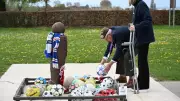 Fundraiser Lays Footballs at Christmas Truce Memorial in Belgium