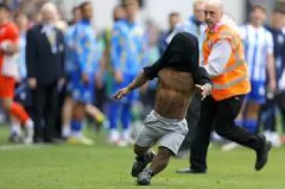 Watch: Dwarf Pitch Invader Eludes Stewards at West Brom Game