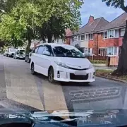 Two Arrested After Stolen Car Rams Parked Vehicles in Police Chase