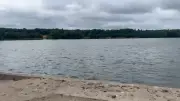 Swan Pool 'Eerily Quiet' After Woman's Body Pulled from Water