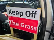 Volunteer group fights grass verge parking in Hall Green with signs