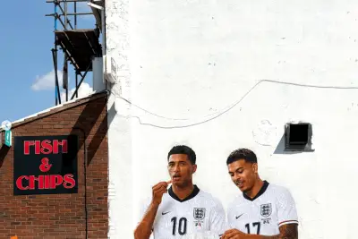 Stunning Mural of Jude Bellingham and Morgan Rogers Eating Orange Chips in Birmingham