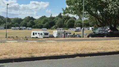 Caravans on Quinton park as travellers arrive with horses