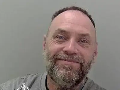 Smiling armed robber jailed after threatening shop worker in Herefordshire
