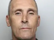 Banned 90mph Derby driver jailed after hitting police car