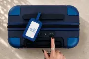 July Checked Suitcase Review: Smart Tracker and 4 Wheels