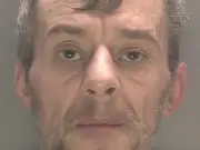 Robber who waved meat cleaver in bank jailed for 19 years
