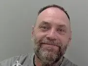 Smiling armed robber jailed after threatening shop worker in Herefordshire